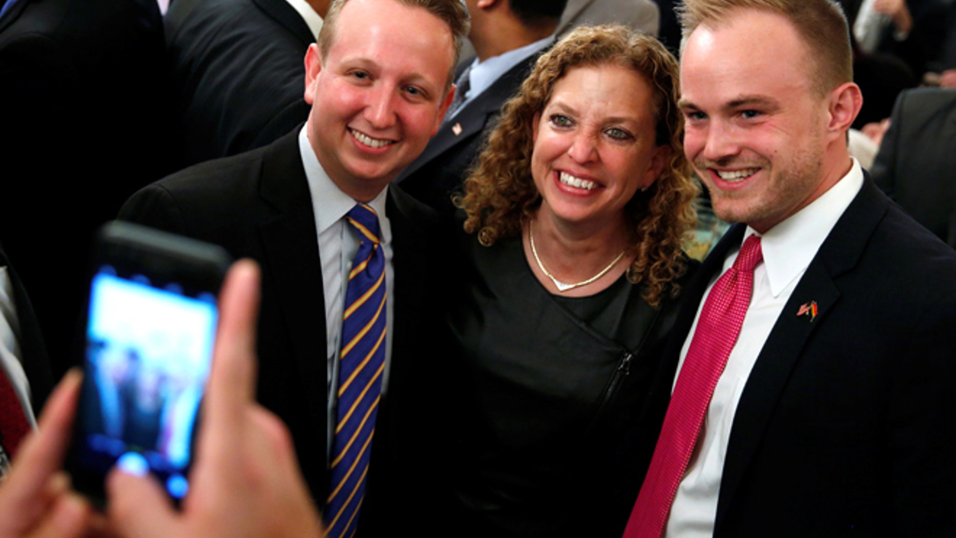Democratic National Committee (DNC) Chair Debbie Wasserman Schultz (D-FL) (2nd R) attends a LGBT Pride Month reception at the White House in Washington, U.S. June 9, 2016. REUTERS/Jonathan Ernst - RTSGTOQ