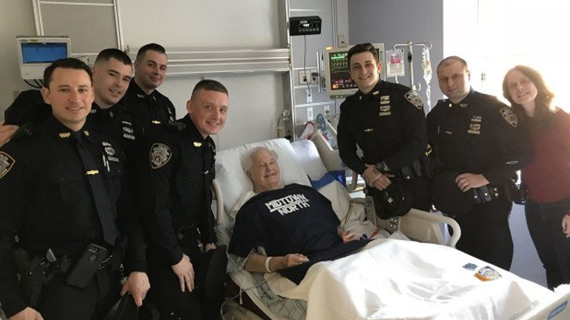 New York City police officers saved an 83-year-old tourist when went into cardiac arrest in Times Square.