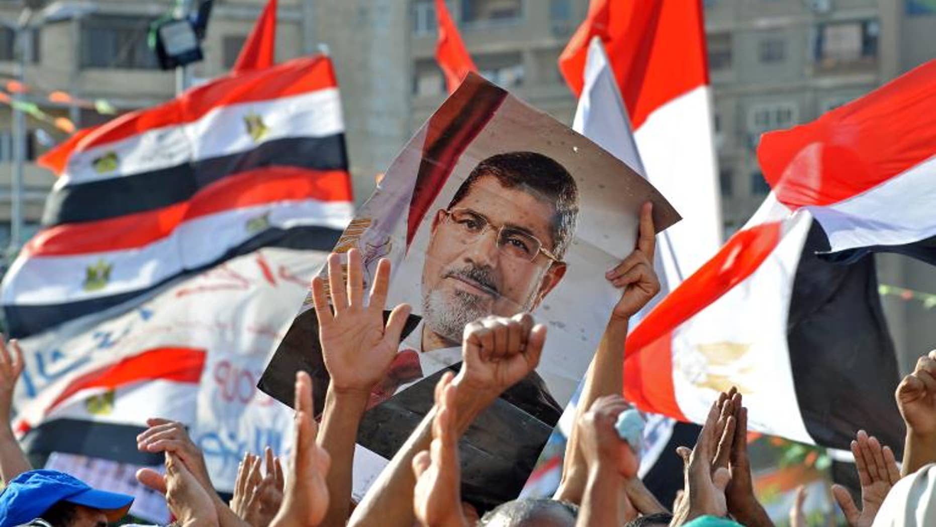 Egyptian supporters of deposed president Mohamed Morsi hold a sit in outside Cairo's Rabaa al-Adawiya mosque on July 24, 2013.