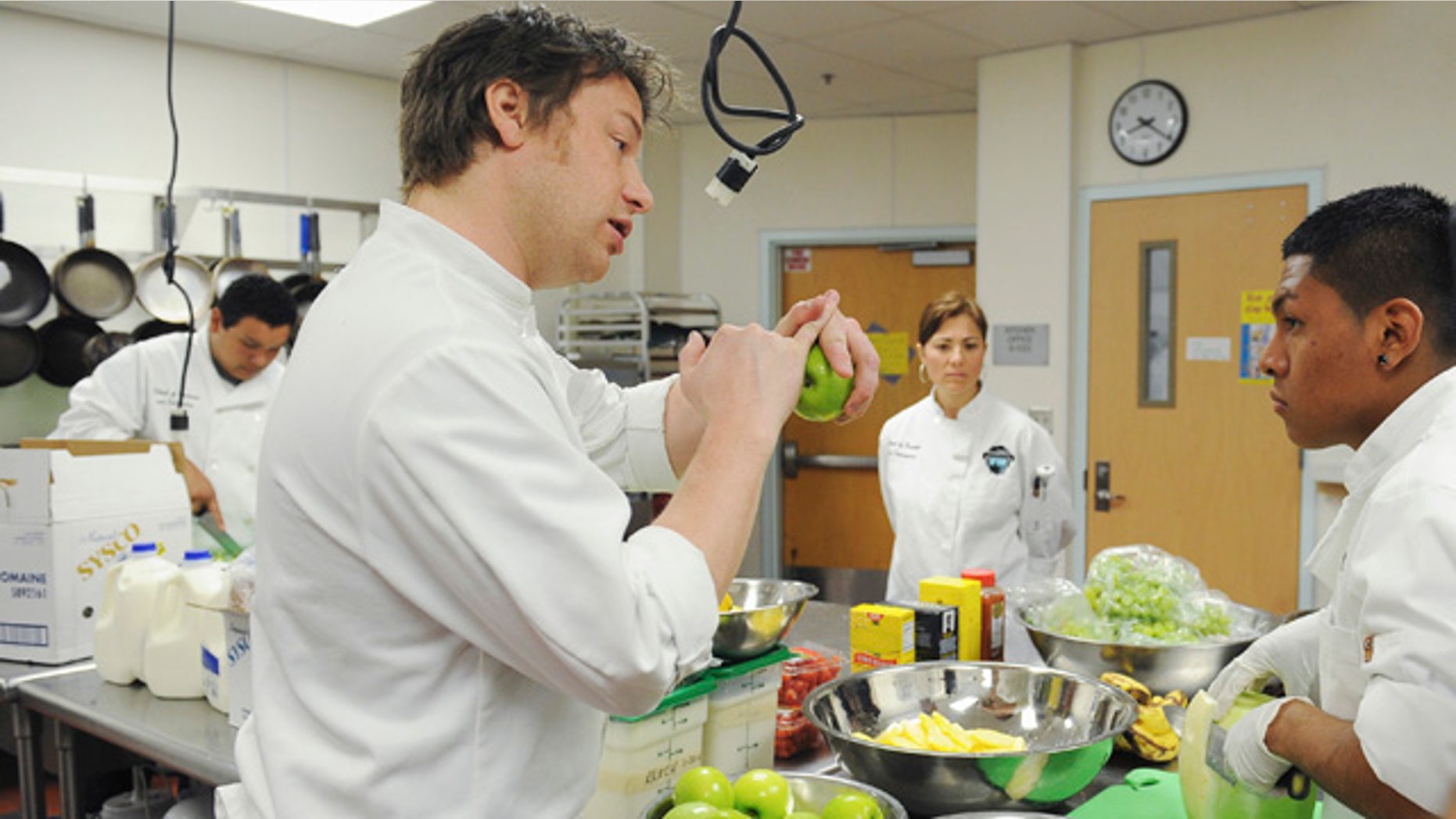 This undated photo courtesy of ABC shows celebrity chef Jamie Oliver during a scene filmed in Los Angeles from the second season of "Jamie Oliver's Food Revolution," on the ABC Television Network. The second season of "Jamie Olivers Food Revolution," which begins Tuesday, April 12, started poorly when the Los Angeles school district barred Oliver's cameras _ greatly complicating a show that focuses on school lunches. (AP Photo/ABC, Mitch Haddad)