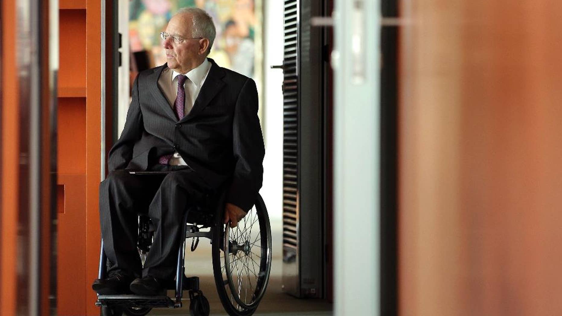 German Finance Minister Wolfgang Schaeuble arrives for the weekly cabinet meeting at the Chancellery in Berlin, Germany, Wednesday, May 18, 2016. (AP Photo/Michael Sohn)