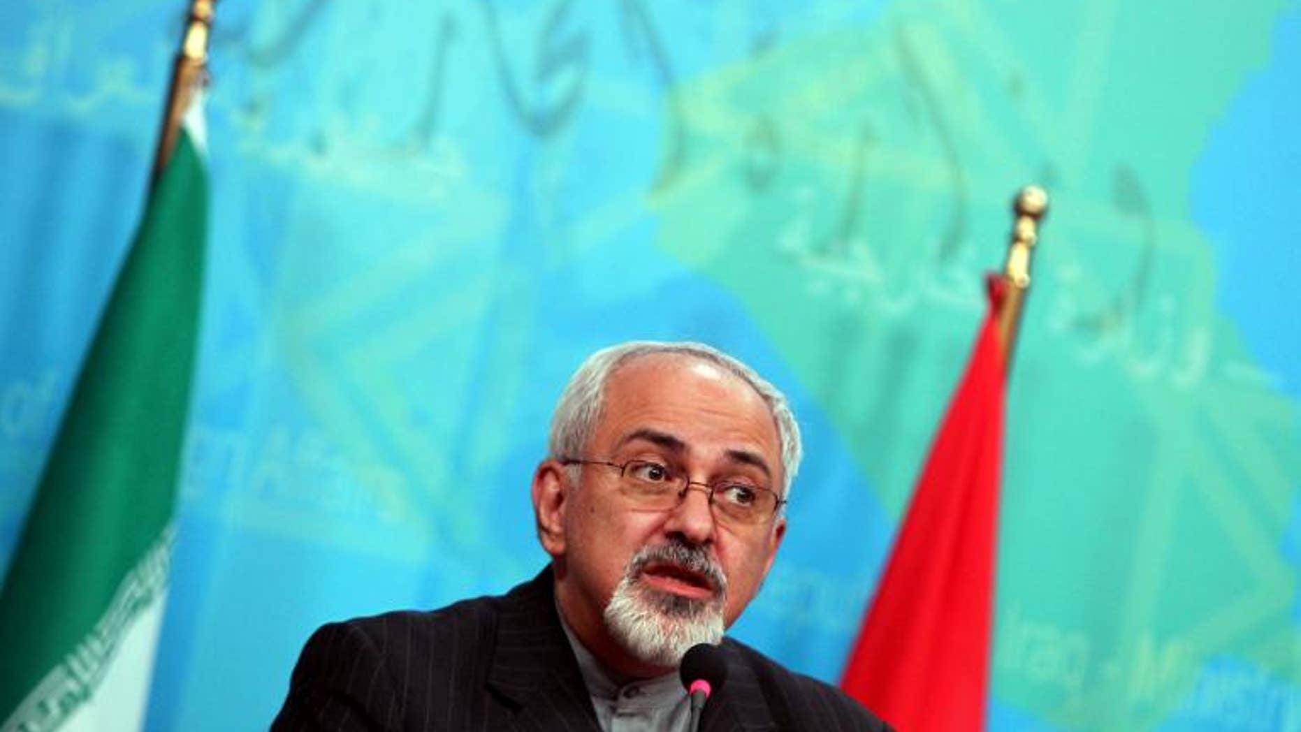 Iranian Foreign Minister Mohammad Javad Zarif speaks during a press conference in Baghdad on September 8, 2013
