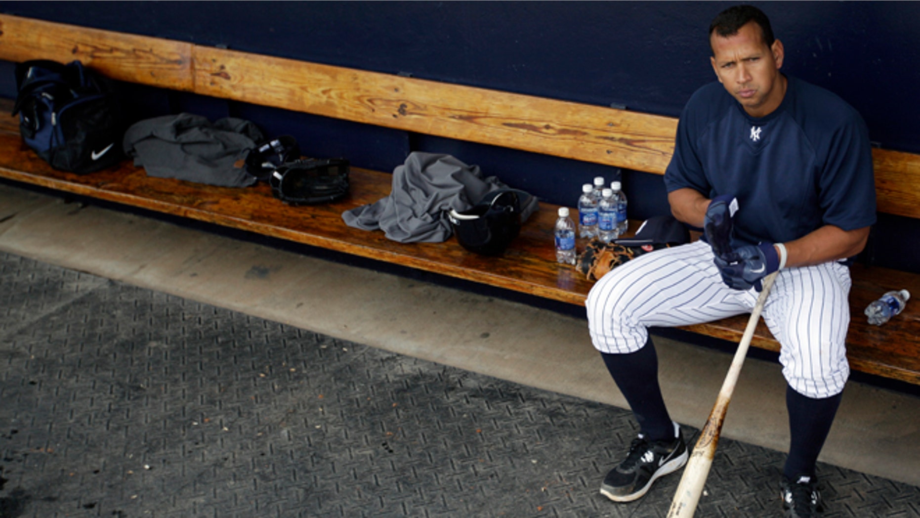 Feb. 25, 2012: New York Yankees' Alex Rodriguez sits in the dugout during practice at baseball spring training in Tampa, Fla. (AP/Matt Slocum, File)