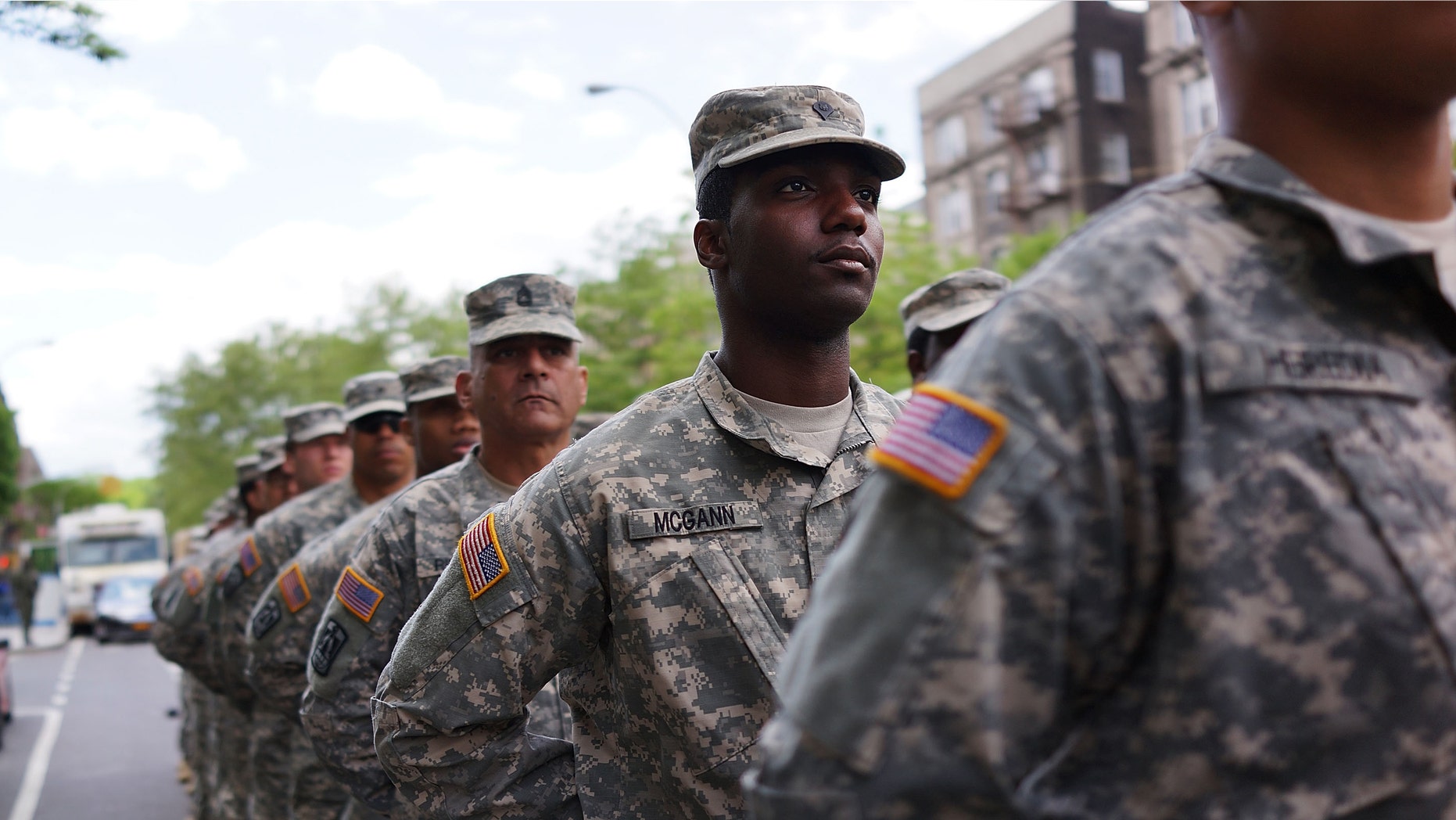 NEW YORK, NY - MAY 18: Memebrs of the Army's 369th Infantry Regiment prepare to march with fellow soldiers, boy scouts and various other military aligned groups in the 369th Infantry Regiment Parade in Harlem on May 18, 2014 in New York City. (Photo by Spencer Platt/Getty Images)
