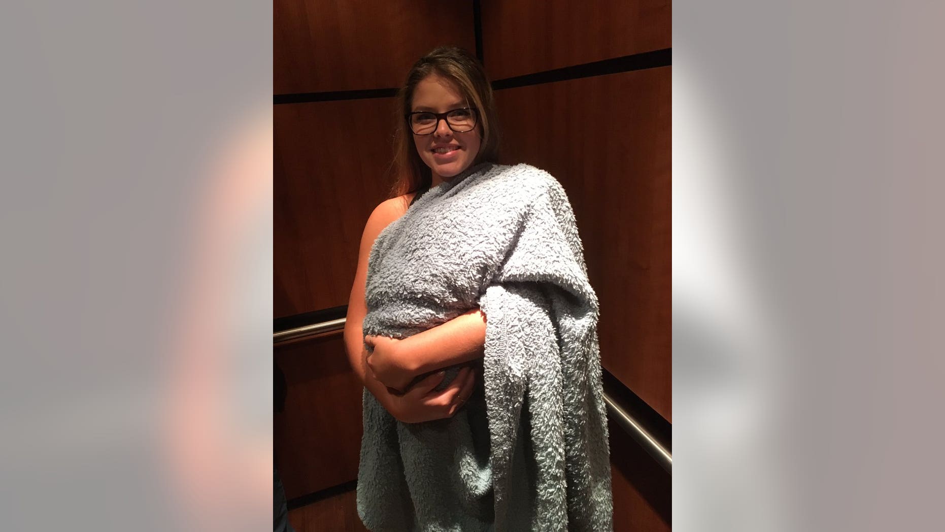 Shelby Hannick with grandmother's dog, Pasty under blanket. (Shelby Hannick)