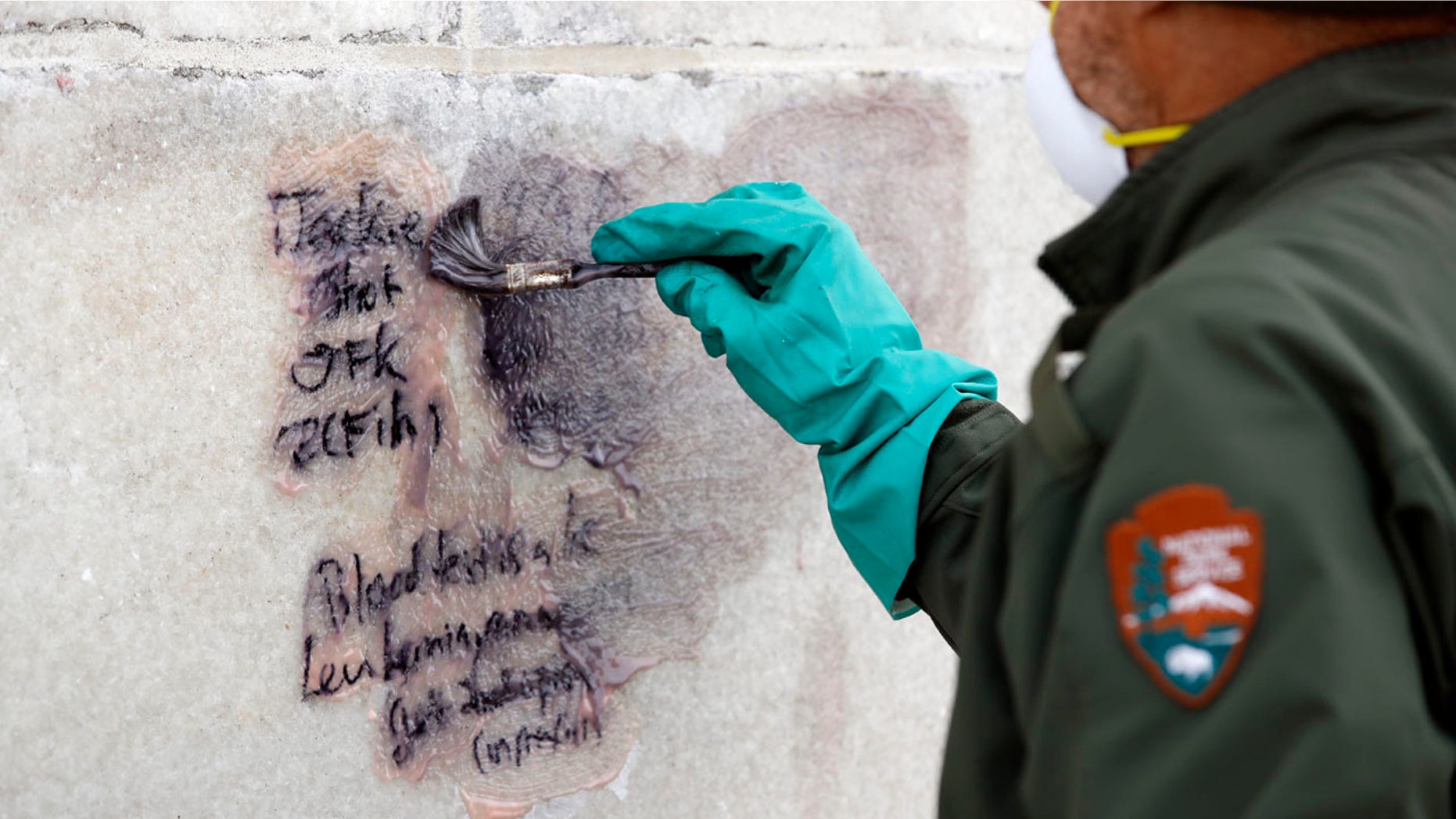 Feb. 21, 2017: A U.S. Park Service employee works to clean graffiti off of the Washington Monument.