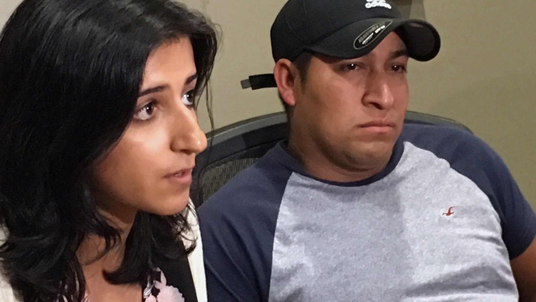 Attorney Saira Hussain, left, and her client, Pedro Figueroa-Zarceno, answer questions about a settlement with the city of San Francisco on Thursday,