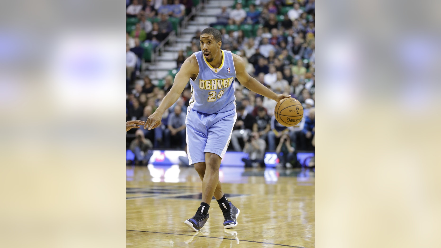 In this Nov. 11, 2013, photo, Denver Nuggets' Andre Miller brings the ball up during an NBA basketball game against the Utah Jazz in Salt Lake City. The Washington Wizards, pushing for their first playoff berth since 2008, acquired Miller from the Nuggets on Thursday, Feb. 20, 2014, in a three-way trade that also involves the Philadelphia 76ers. The Wizards gave up two seldom-used players--forward Jan Vesely and point guard Eric Maynor. Vesely goes to the Nuggets, while Maynor gets shipped to the 76ers. (AP Photo/Rick Bowmer)