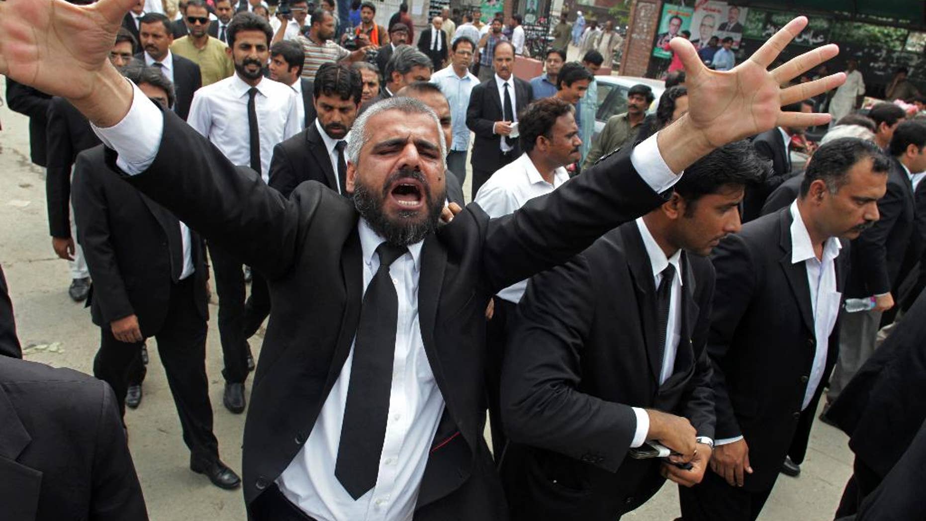 A Pakistan lawyer shouts slogans during a demonstration to condemn a suiciding bombing in Quetta that killed dozens of people and wounded many more, in Lahore, Pakistan, Monday, Aug. 8, 2016. Senior police official Zahoor Ahmed Afridi says the blast took place shortly after the body of a prominent lawyer, killed in a shooting attack earlier in the day, was brought to the hospital. It's unclear if the two events are in any way connected. (AP Photo/K.Chaudary)