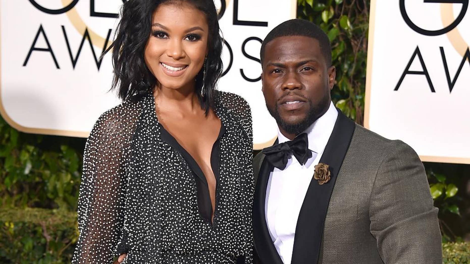 Eniko Parrish, left, and Kevin Hart arrive at the 73rd annual Golden Globe Awards in Beverly Hills, Calif.