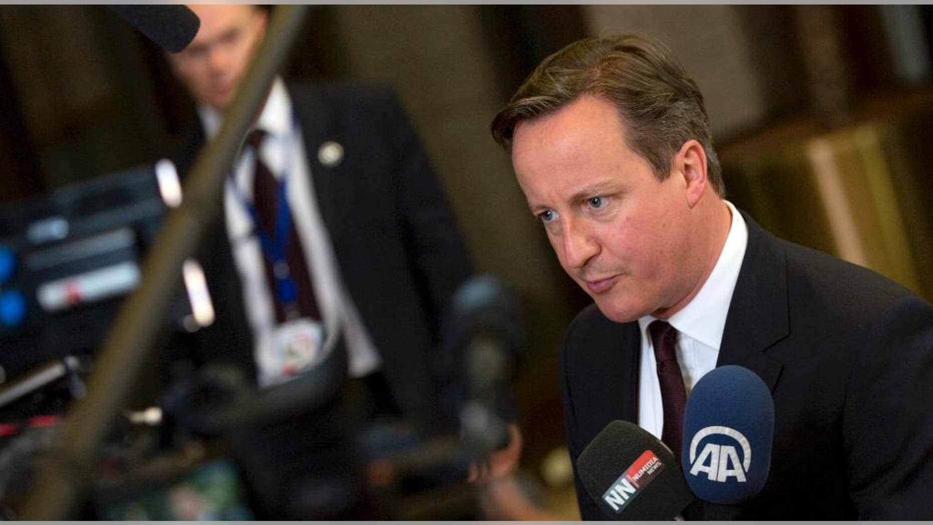 British Prime Minister David Cameron speaks with the media after an EU summit in Brussels on Friday, June 26, 2015. European leaders have tasked finance ministers from the euro countries with concluding a debt financing agreement with Greece over the weekend, just days before Athens has to meet a crucial debt deadline. (AP Photo/Virginia Mayo)