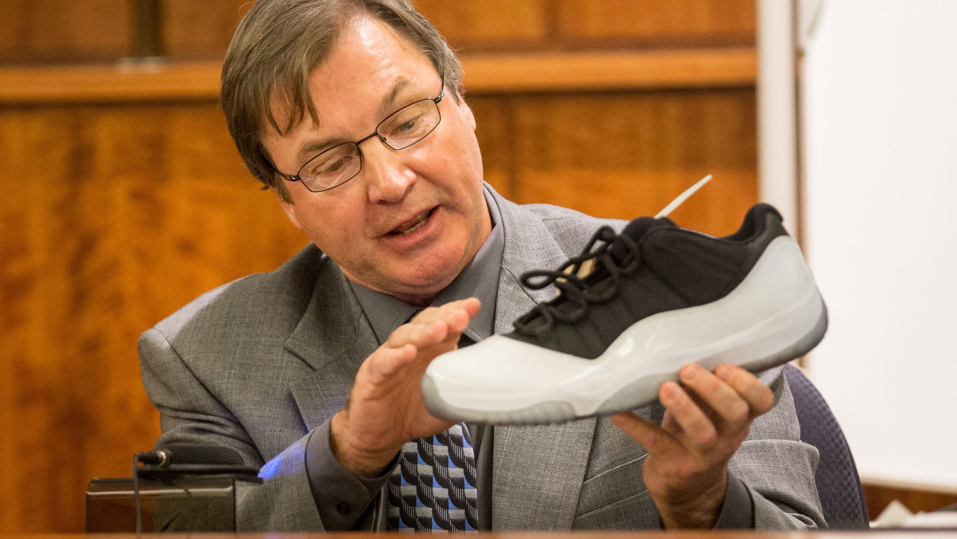 Herbert Hedges, a Nike shoe expert, testifies during former New England Patriots football player Aaron Hernandez's murder trial, Tuesday, March 17, 2015, in Fall River, Mass. Hernandez is charged with killing semiprofessional football player Odin Lloyd. (AP Photo/The Boston Globe, Aram Boghosian, Pool)