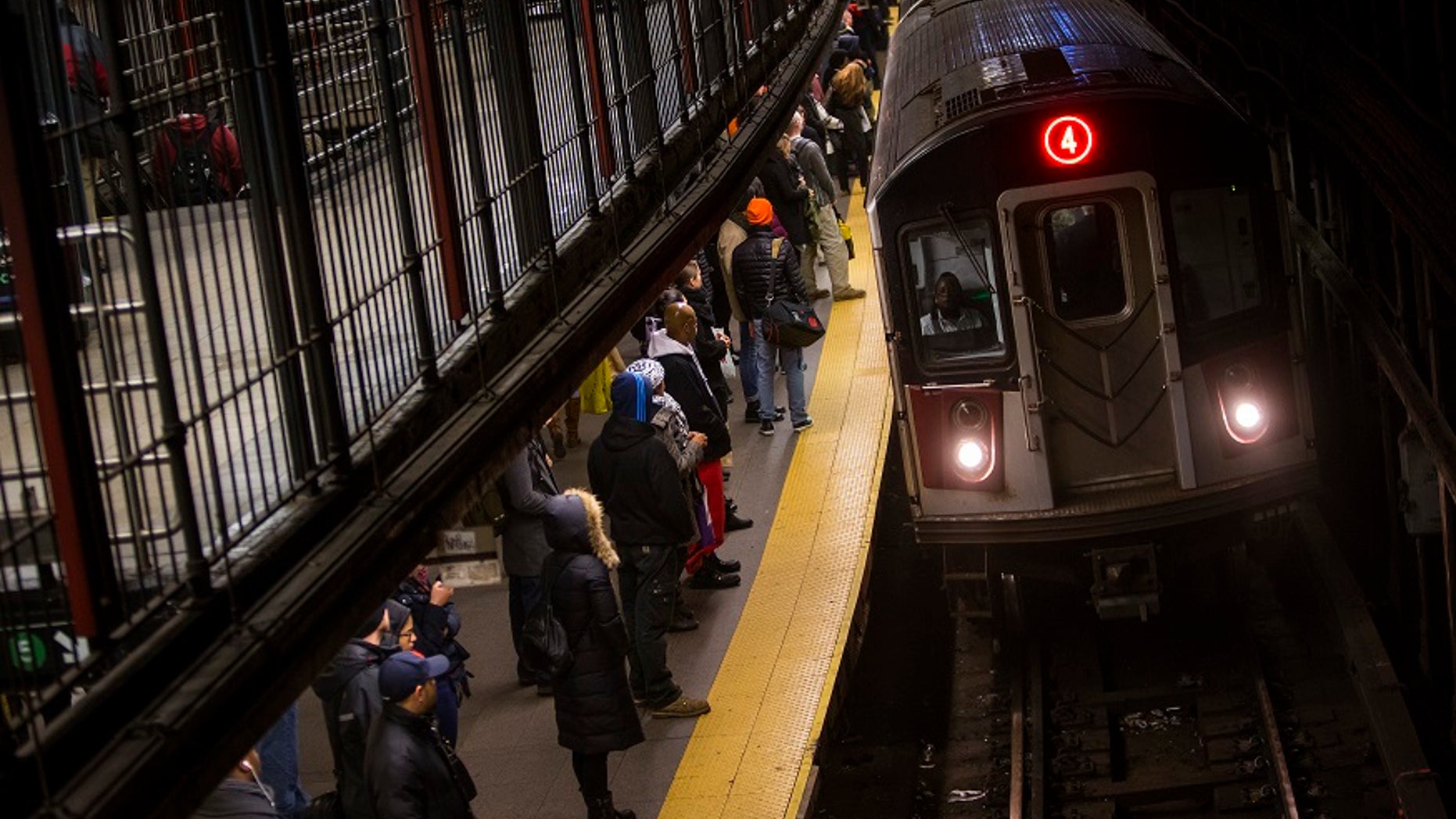 A woman was pushed onto the tracks of a New York City subway on Tuesday night, police said.