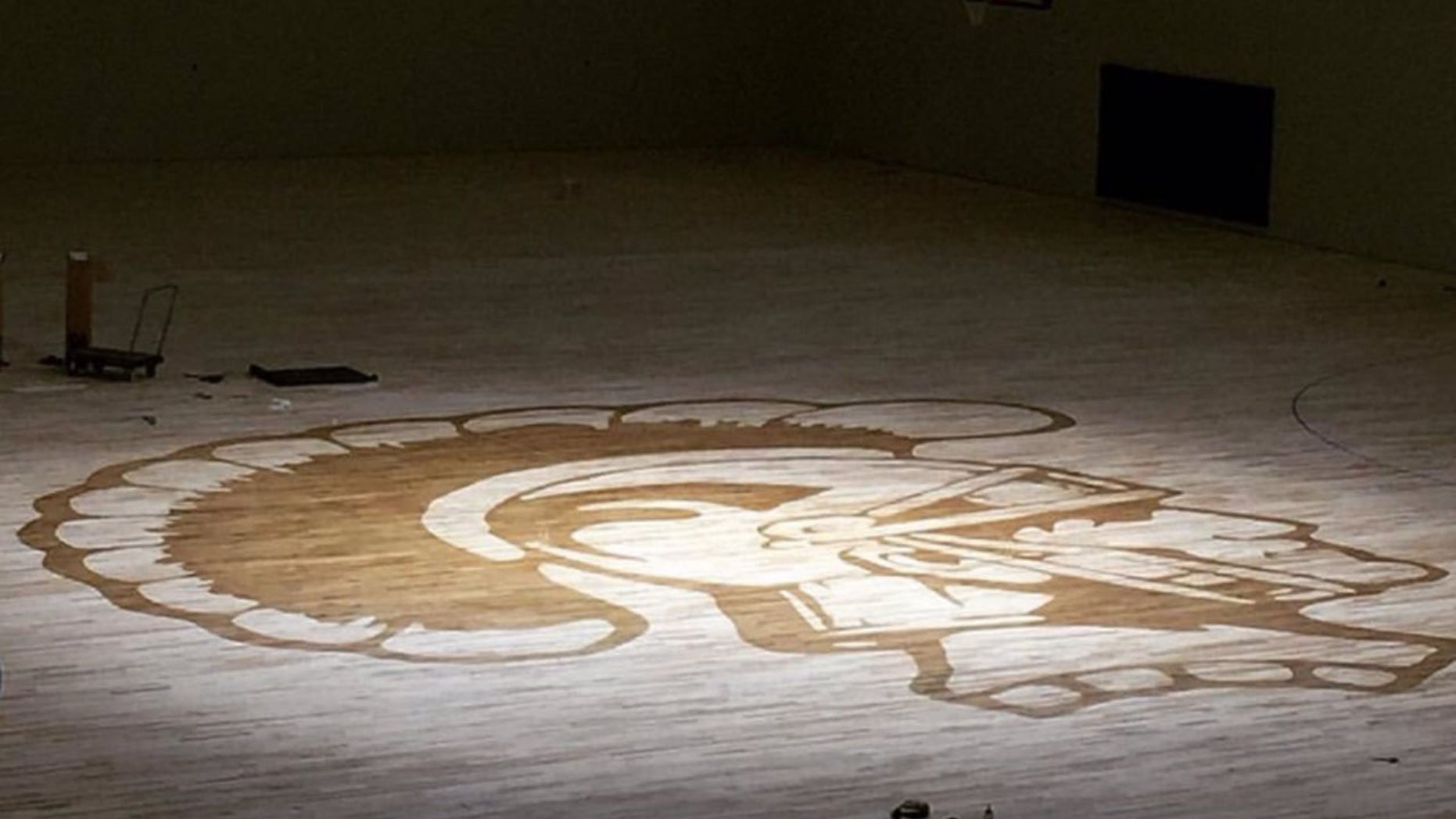 The Kelly Walsh High School's Trojan logo on the gym floor. A freshman student left the school after he was reportedly waterboarded by members of the wrestling team.