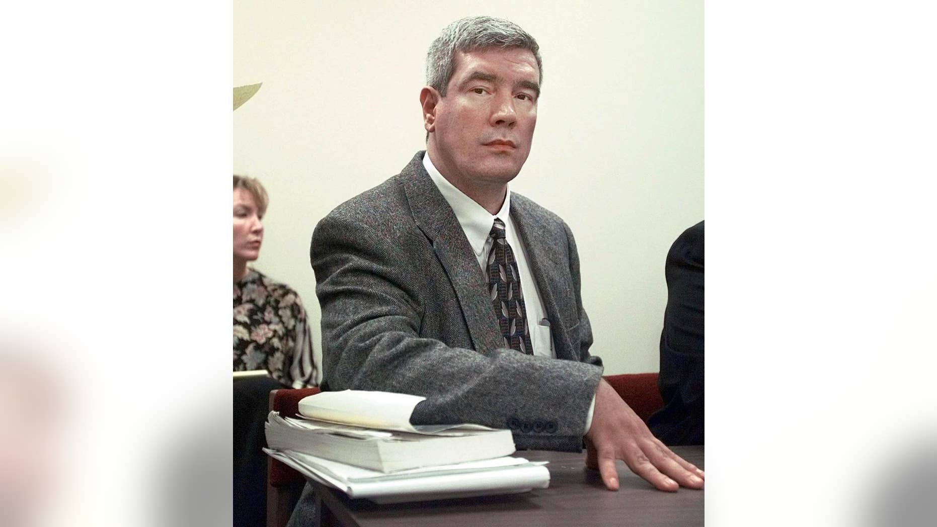 FILE - In this Feb. 8, 1999, file photo, Kerry Max Cook sits in a courtroom in Bastrop, Texas. Cook, a former death row inmate, says he wants to nullify an agreement his lawyers made that calls for his murder charge to be dismissed but also protects prosecutors from potential misconduct allegations. (AP Photo/LM Otero, File)