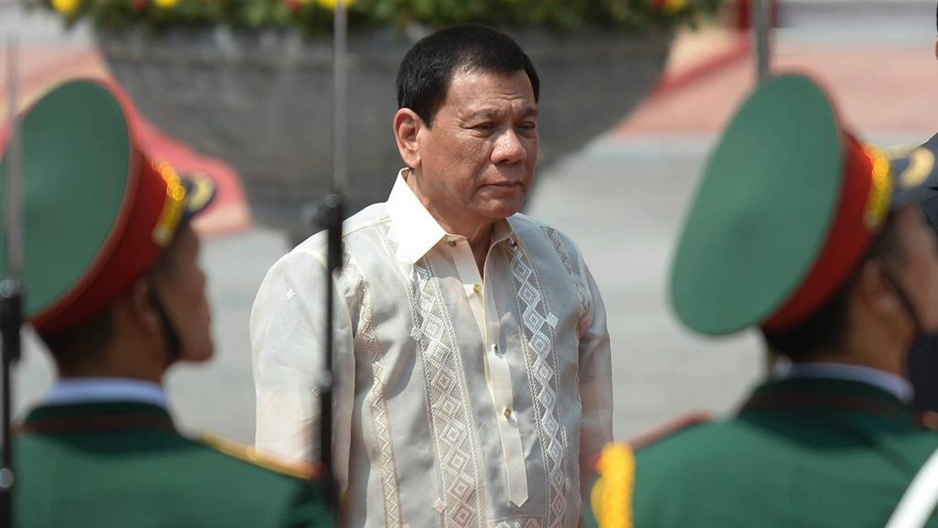 FILE - In this Thursday, Sept. 29, 2016 file photo, Philippine President Rodrigo Duterte reviews an honor guard during a welcome ceremony at the Presidential Palace in Hanoi during his two-day visit to Vietnam. Israel's Foreign Ministry says it's "unfortunate" that Duterte chose to invoke Adolf Hitler and the Holocaust in his bloody anti-crime war. Spokesman Emmanuel Nahshon says Saturday, Oct. 1, Israel is convinced the Philippine president "will find a way to clarify his words." (Hoang Dinh Nam/Pool Photo via AP, File)