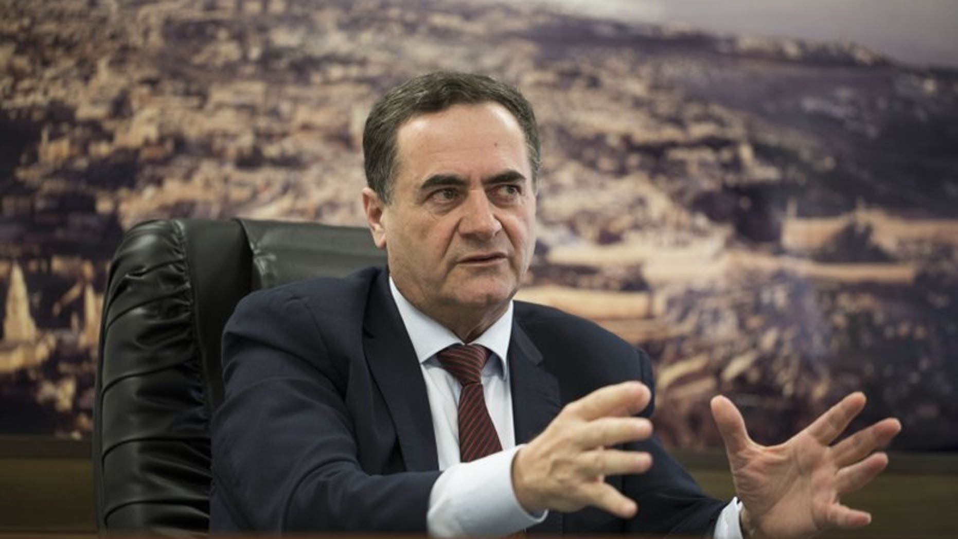 Yisrael Katz, Israel's transportation and intelligene minister, speaks with journalists in his office in Tel Aviv, March 7, 2017.