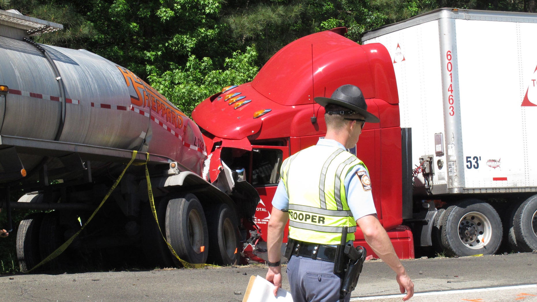A Georgia state trooper works the scene of a deadly crash in April 2015.
