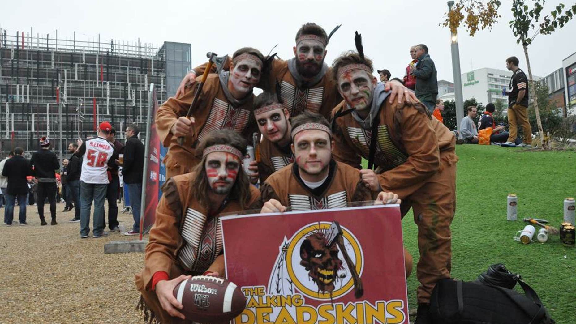 Fans supporting the Redskins show off a Washington-themed homage to TV show "The Walking Dead" before an NFL game in London.
