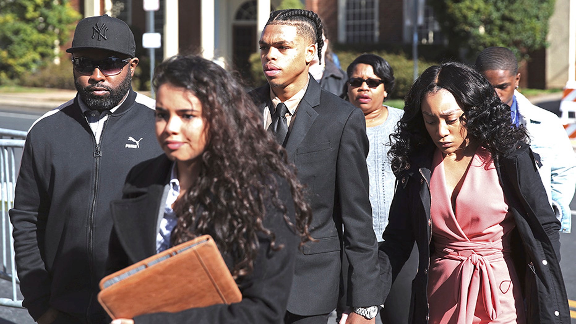 DeAndre Harris, second from right, enters the Charlottesville District Court in Virginia ahead of his trial on Friday.
