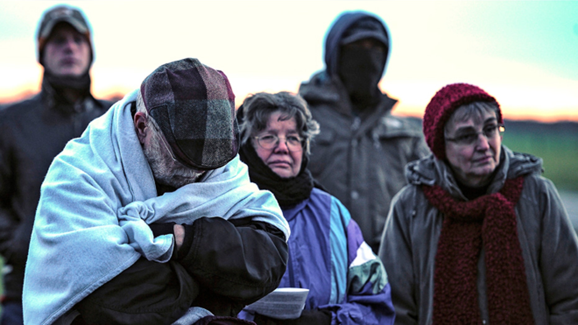 FILE: Jan. 7, 2014: A family from Daytona, Ohio protest against the death penalty in front of the Florida State Prison near Starke, Fla.