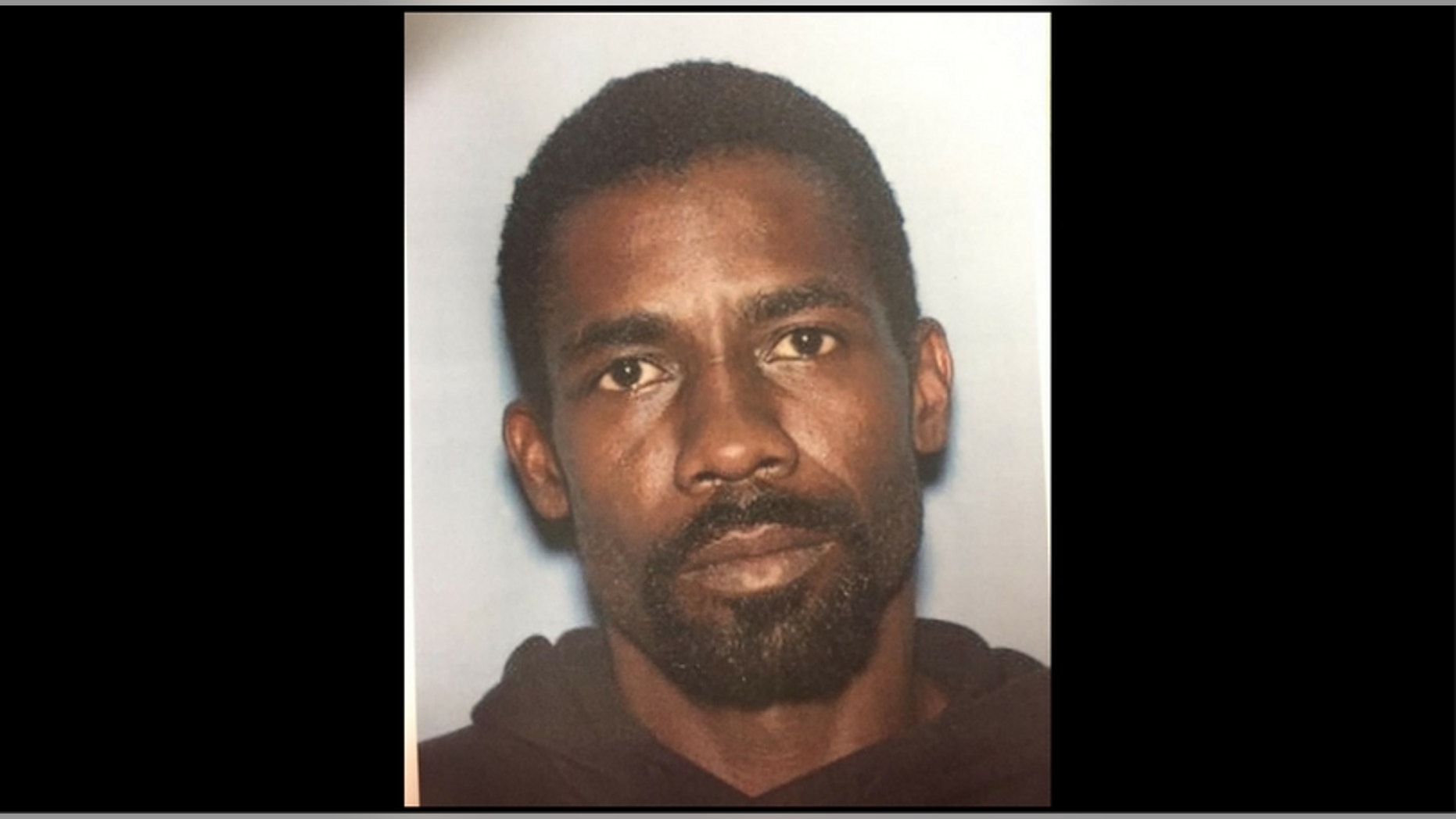 Alrick Powell, 39, is accused of dousing his wife with lighter fluid and setting her on fire.