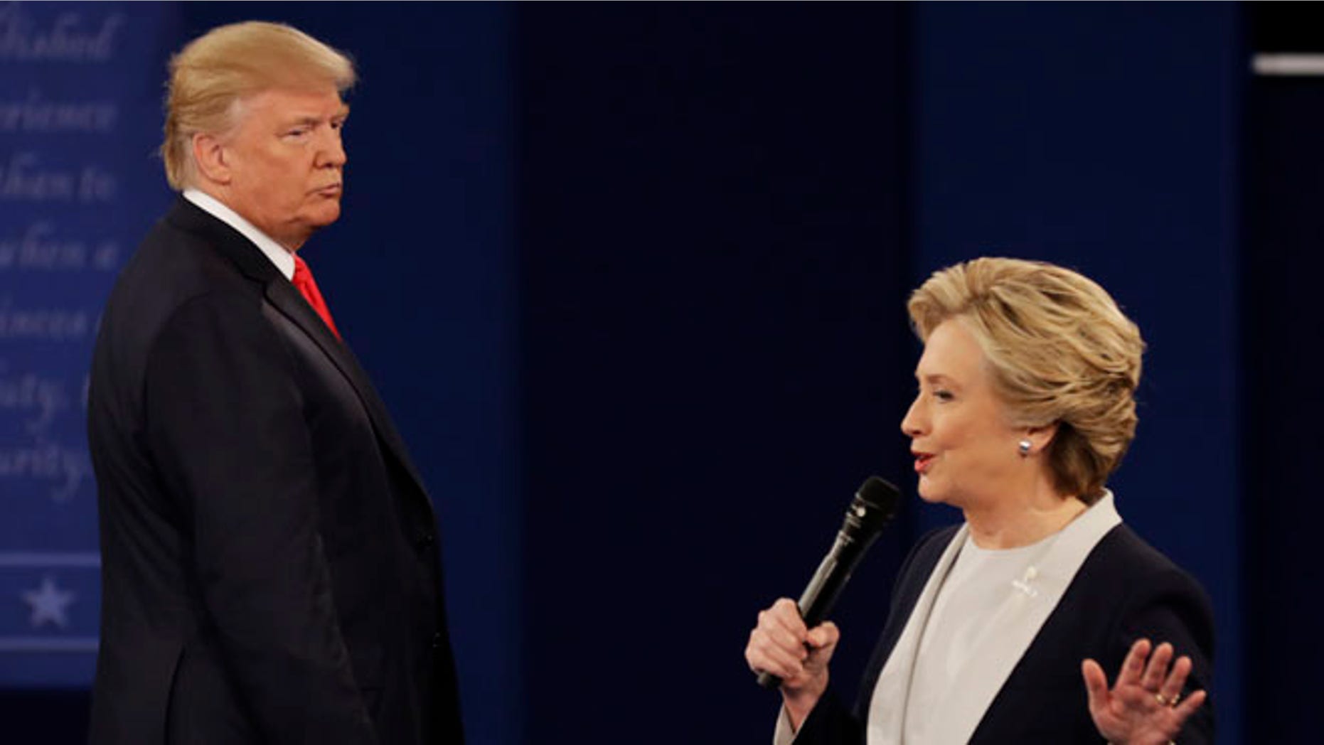 Republican presidential nominee Donald Trump listens to Democratic presidential nominee Hillary Clinton during the second presidential debate at Washington University in St. Louis, Sunday, Oct. 9, 2016. (AP Photo/Patrick Semansky)