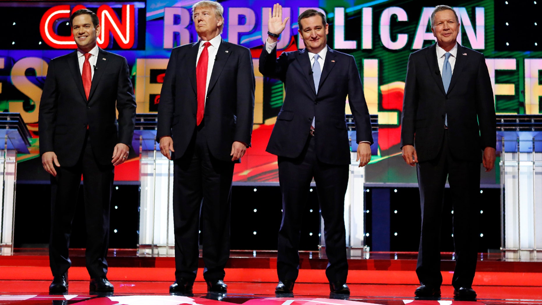 Republican U.S. presidential candidates (L-R) Marco Rubio, Donald Trump, Ted Cruz and John Kasich stand together onstage at the start of the Republican candidates debate sponsored by CNN at the University of Miami in Miami, Florida, March 10, 2016. REUTERS/Joe Skipper - RTSA9ZC