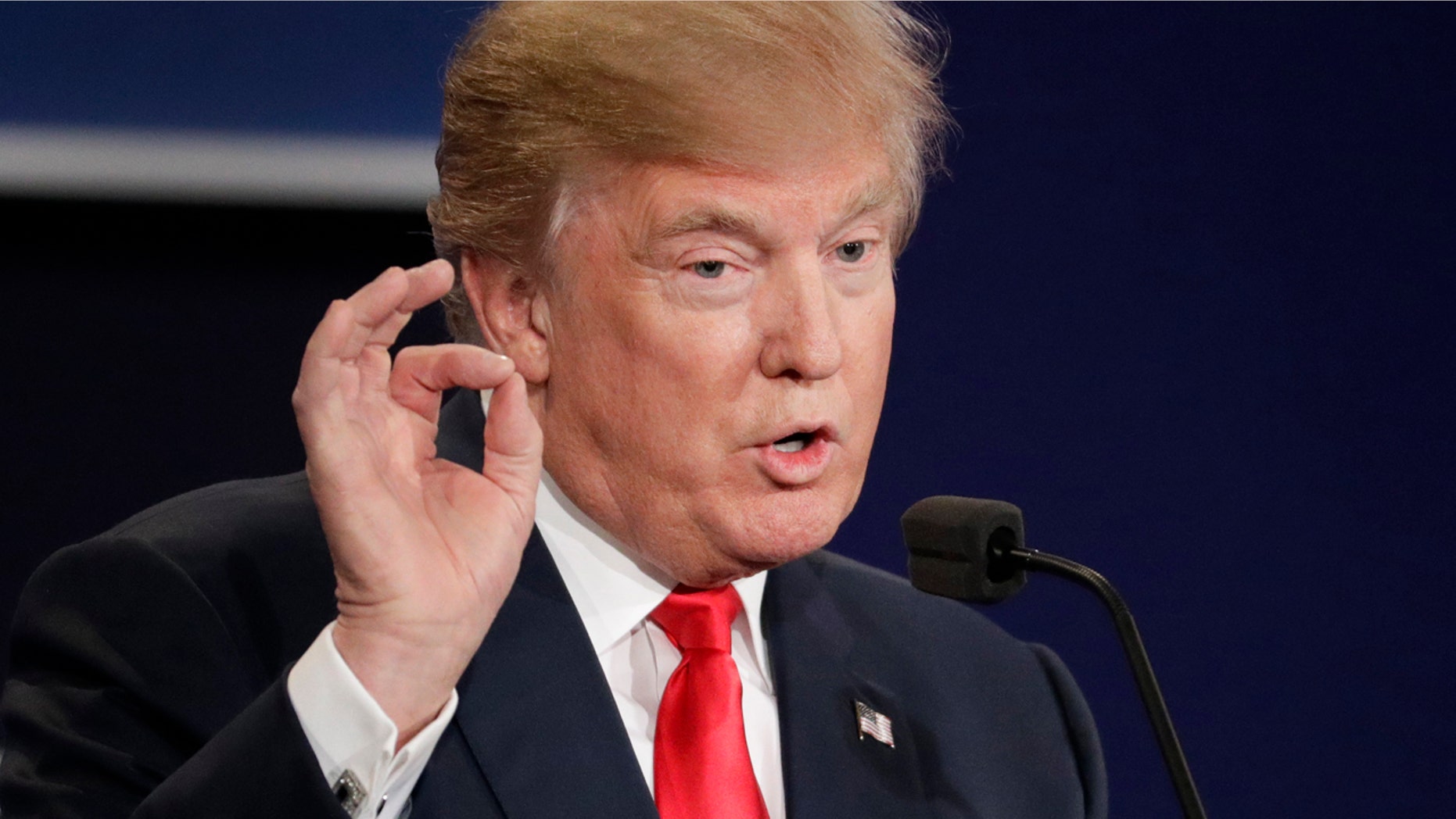 Republican presidential nominee Donald Trump answers a question during the third presidential debate at UNLV in Las Vegas, Wednesday, Oct. 19, 2016. (AP Photo/John Locher)