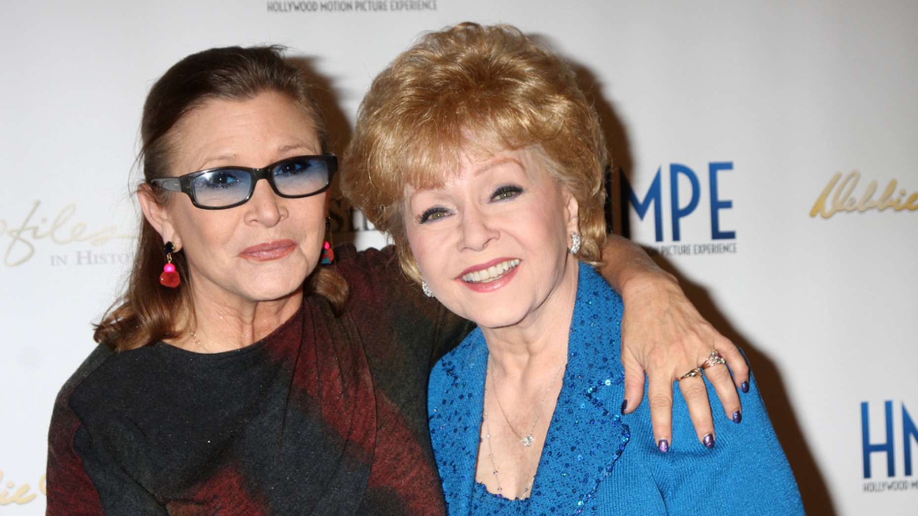 Debbie Reynolds (right) with her daughter, Carrie Fisher, in North Hollywood, California in 2014.
