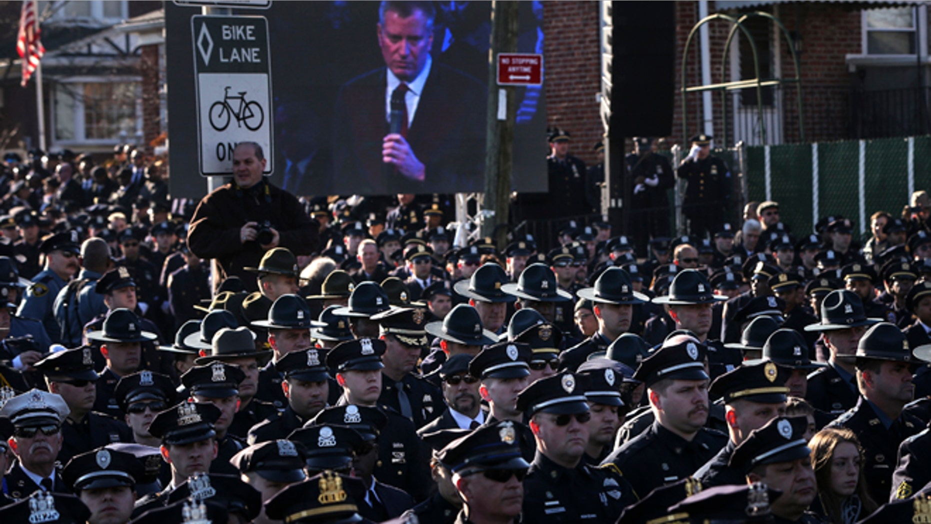 Dec. 27: Law enforcement officers turn their backs on a live video monitor showing New York City Mayor Bill de Blasio as he speaks at the funeral of slain New York Police Department officer Rafael Ramos near Christ Tabernacle Church in the Queens.