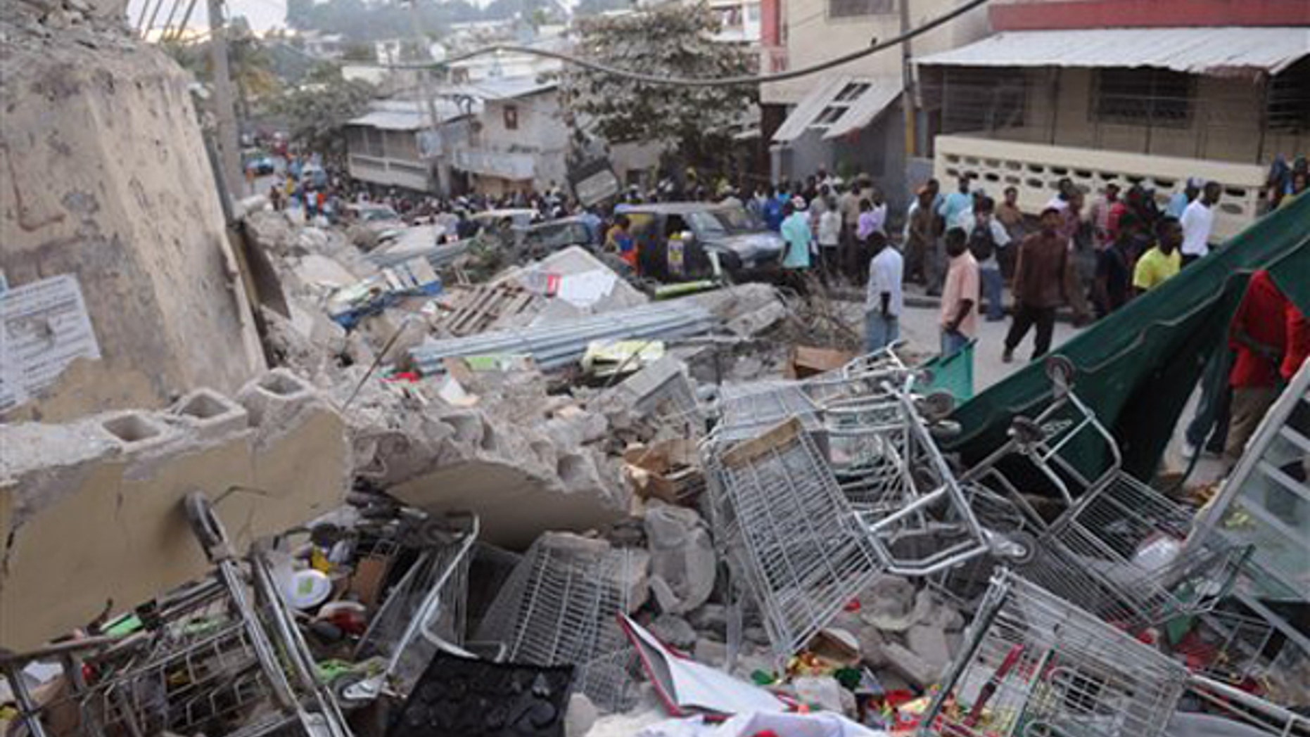 Debris lays in the street after an earthquake along the Delmas road in Port-au-Prince, Haiti, Wednesday, Jan. 13, 2010. (AP)