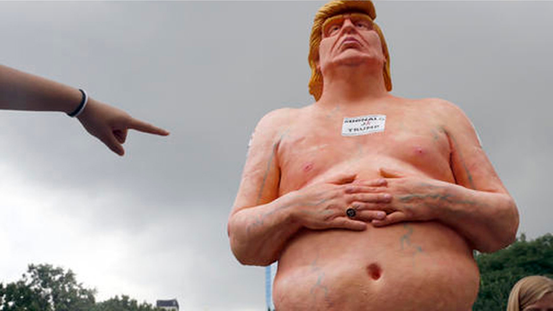 A statue of a naked Donald Trump.