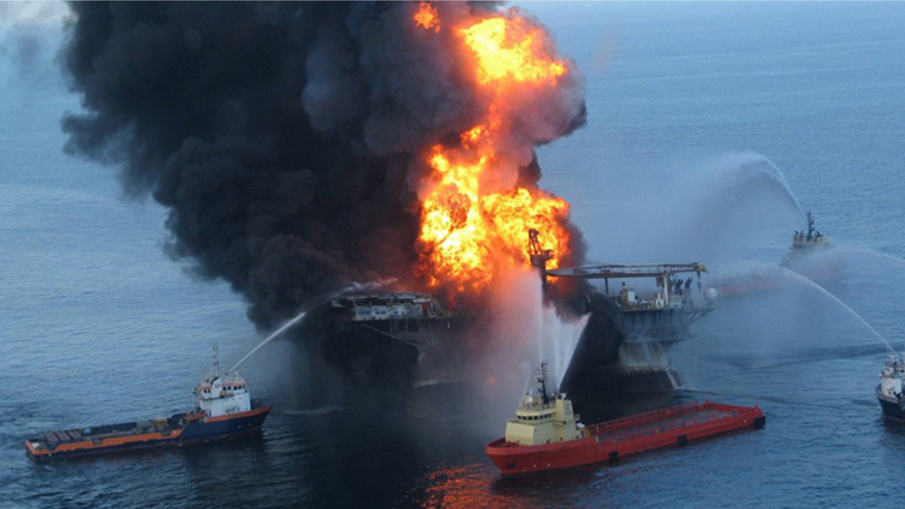 FILE 2010: Fire boat response crews battle the blazing remnants of the offshore oil rig Deepwater Horizon off Louisiana.