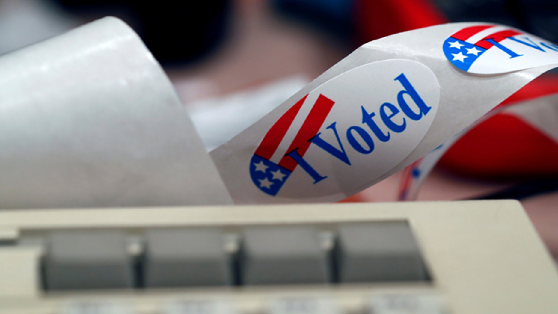 A "I Voted" sticker is shown by a keyboard in the Voting Machine Hacking Village during the Def Con hacker convention in Las Vegas, Nevada, U.S. on July 29, 2017. REUTERS/Steve Marcus - RTS19P33