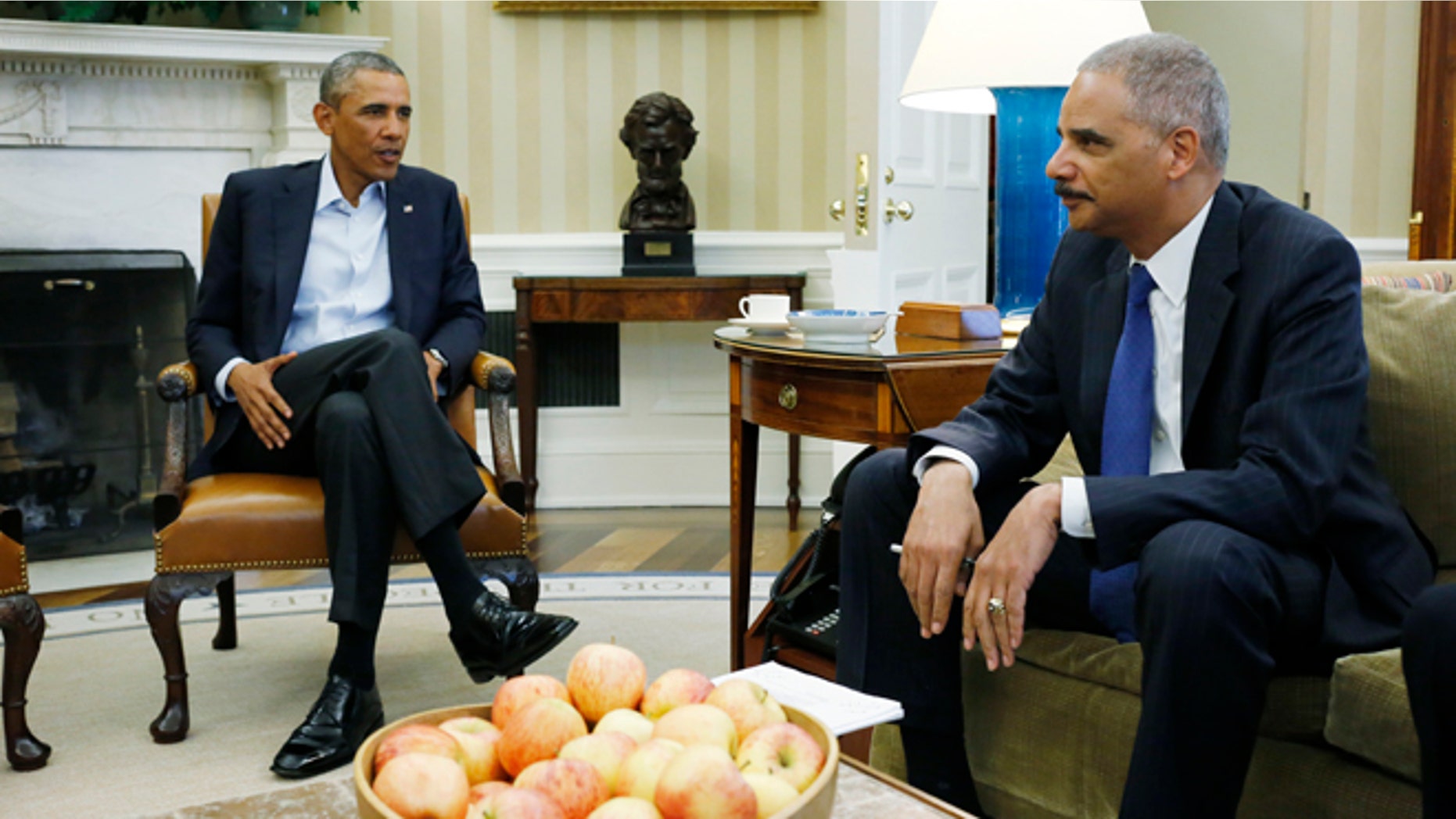 FILE - In this Aug. 18, 2014 file photo, President Barack Obama meets with Attorney General Eric Holder regarding the fatal police shooting of Michael Brown in Ferguson, Missouri, in the Oval Office at the White House in Washington. Holder is resigning after serving as head of the Justice Department for six years. (AP Photo/Charles Dharapak, File)