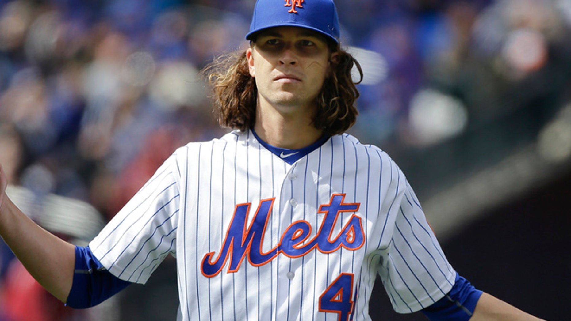 New York Mets pitcher Jacob deGrom (48) reacts as he walks off the field at the end of the top of the sixth inning after giving up the tying run to the Philadelphia Phillies during a baseball game, Friday, April 8, 2016, in New York. (AP Photo/Julie Jacobson)