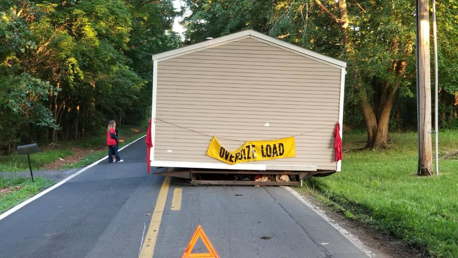 Investigators are trying to determine who abandoned a house on a street in Dover, Del.