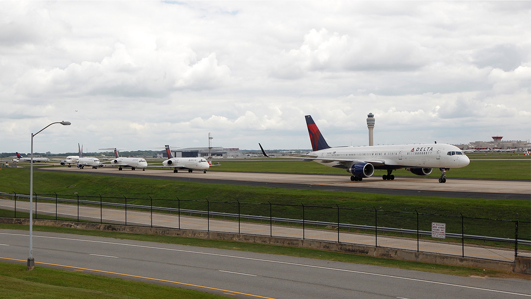 The man says he asked a flight attendant to use the restroom, but was told they would lose their place in line for takeoff.