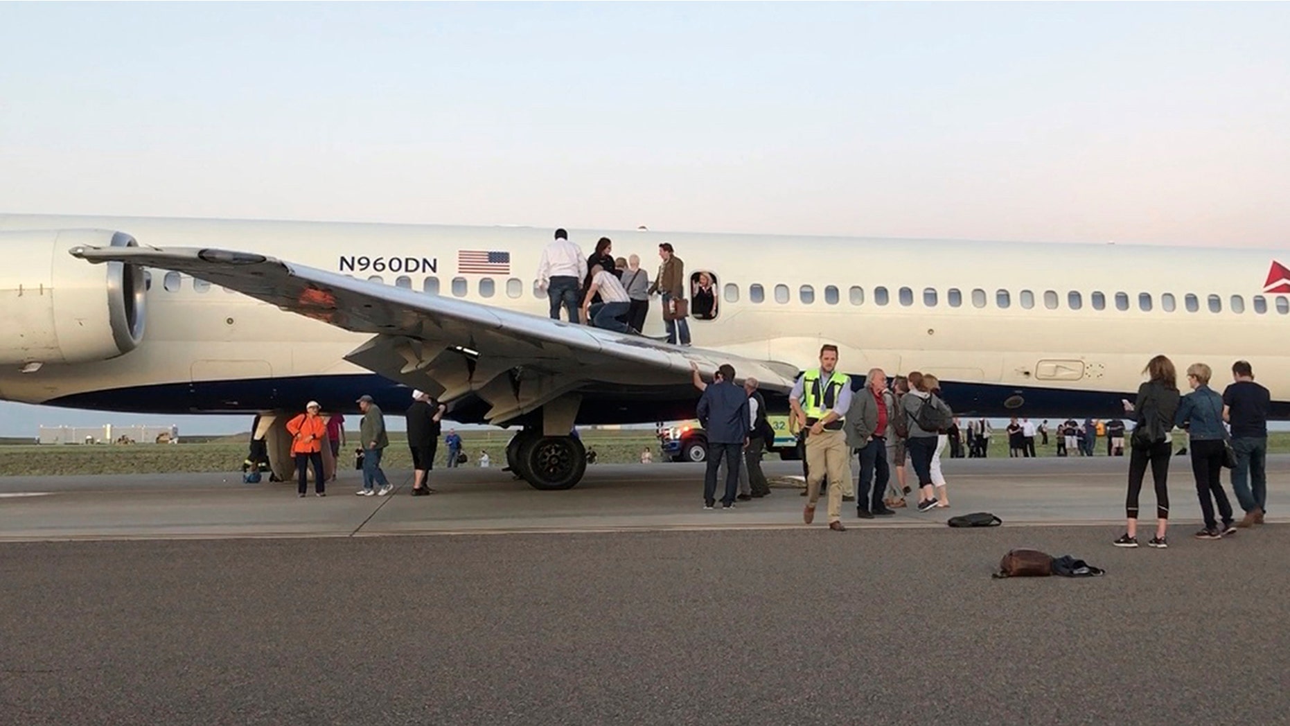 Passengers aboard a Delta Airlines jet were forced into an emergency evacuation moments after landing on the runway of Denver International Airport.