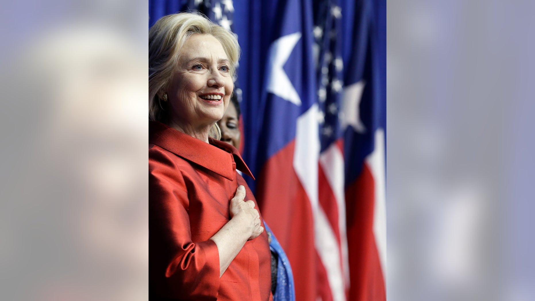 FILE -- June 4, 2015: Democratic presidential candidate Hillary Rodham Clinton listens to the National Anthem before speaking at Texas Southern University in Houston. (AP Photo/Pat Sullivan)