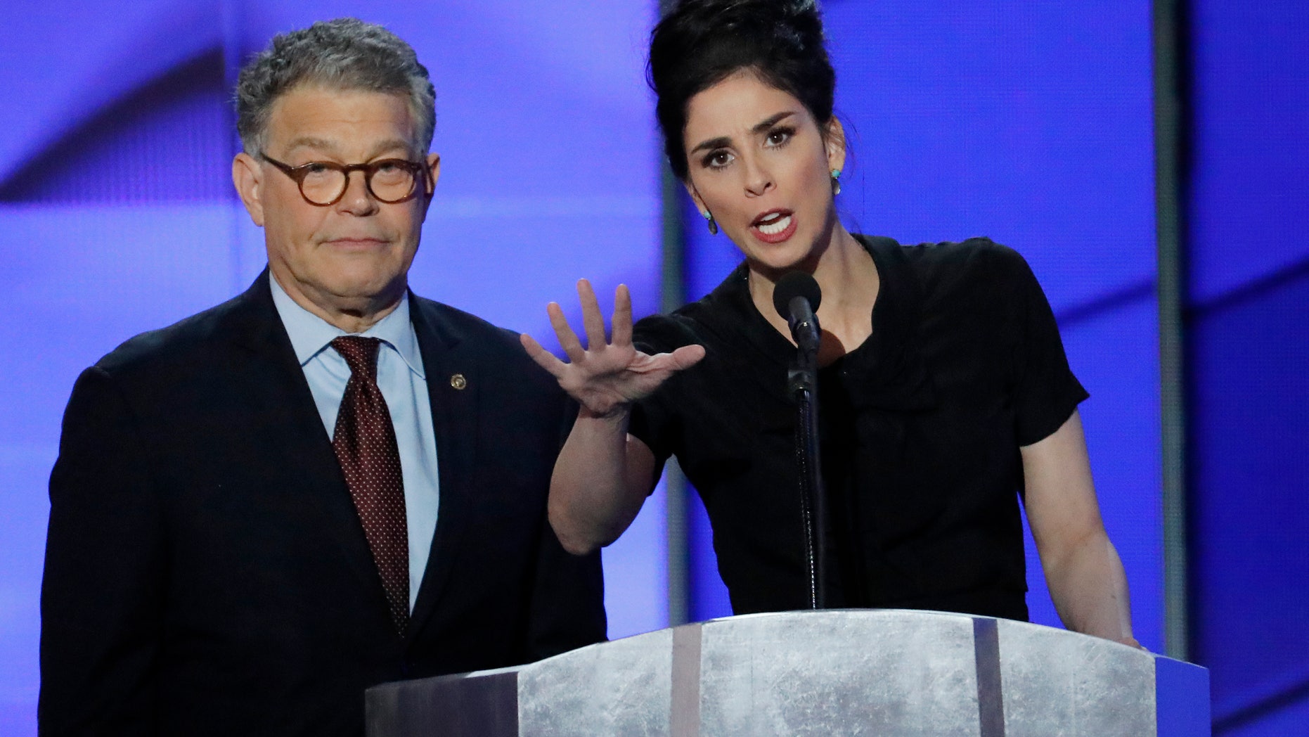 Sen. Al Franken, D-Minn., and comedian Sarah Silverman speak during the first day of the Democratic National Convention in Philadelphia , Monday, July 25, 2016.