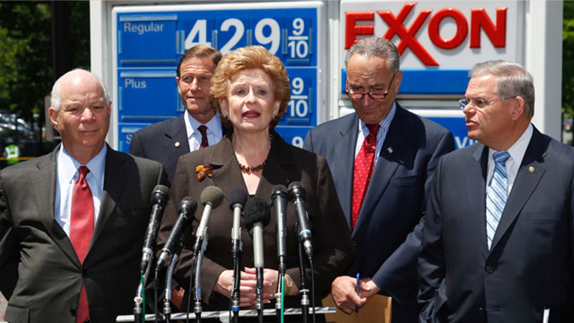 Democratic Senators, from left, Ben Cardin from Maryland, Richard Blumenthal from Connecticut, Debbie Stabenow from Michigan, Charles Schumer from New York, and Robert Menendez from New Jersey take part in a news conference at an Exxon gas station on Capitol Hill in Washington, Wednesday, May 11, 2011, to talk about oil industry subsidies to help reduce the deficit.