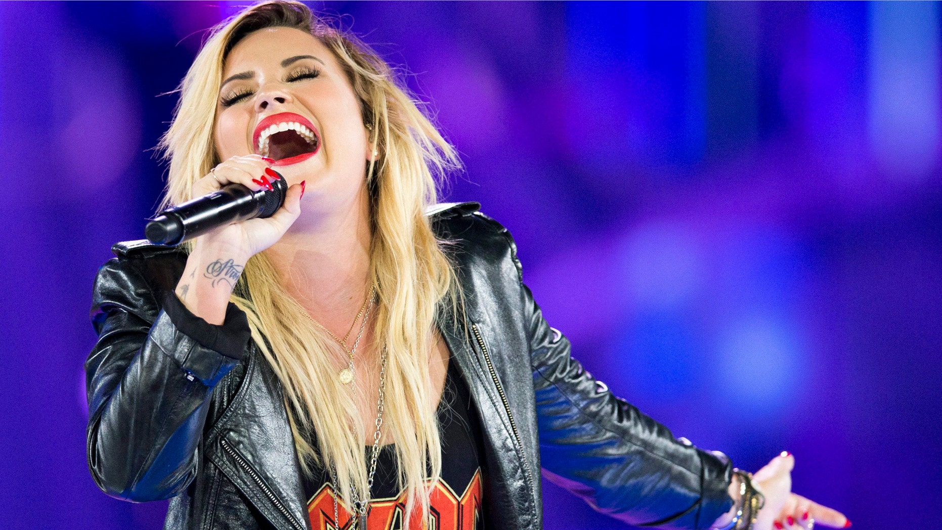 Demi Lovato performs during We Day in Toronto, on Friday Sept. 20, 2013.