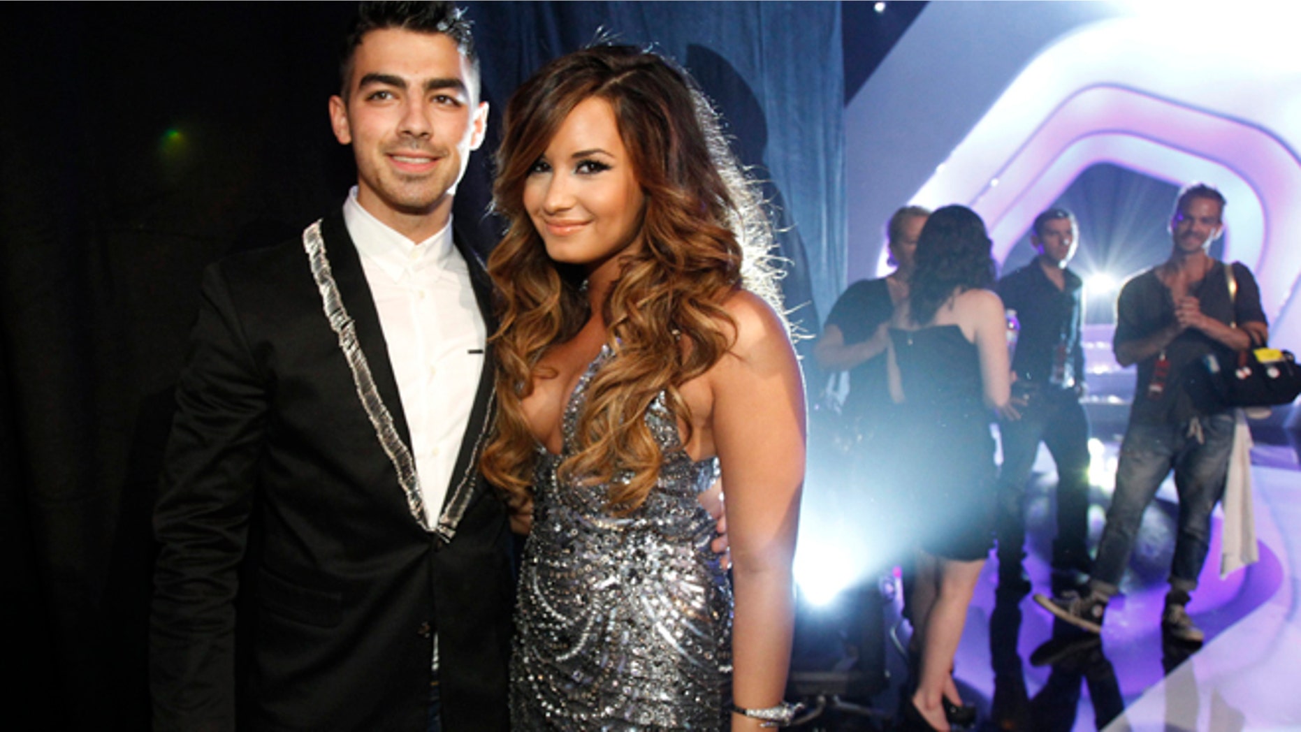 August 28, 2011. Singers Joe Jonas and Demi Lovato (R) arrive at the 2011 MTV Video Music Awards in Los Angeles.