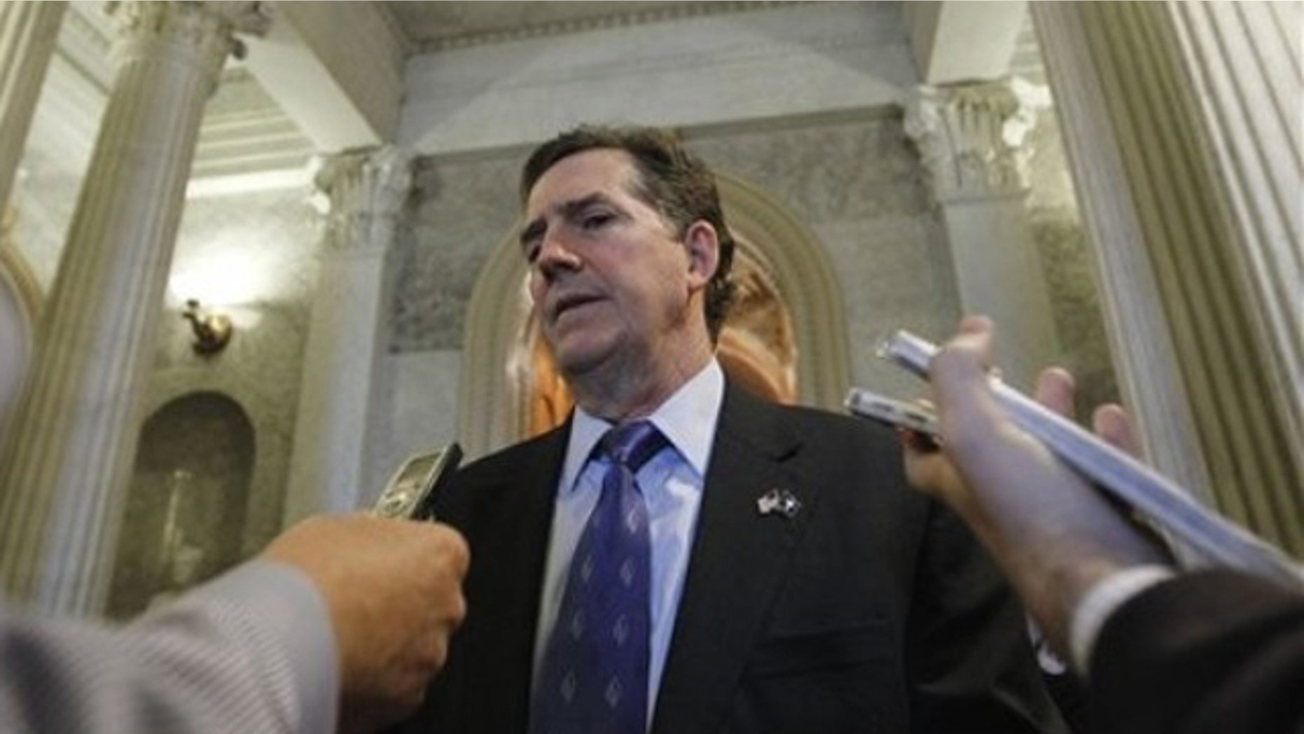 Sen. Jim DeMint talks with reporters near the Senate floor on Capitol Hill Dec. 22, 2010.