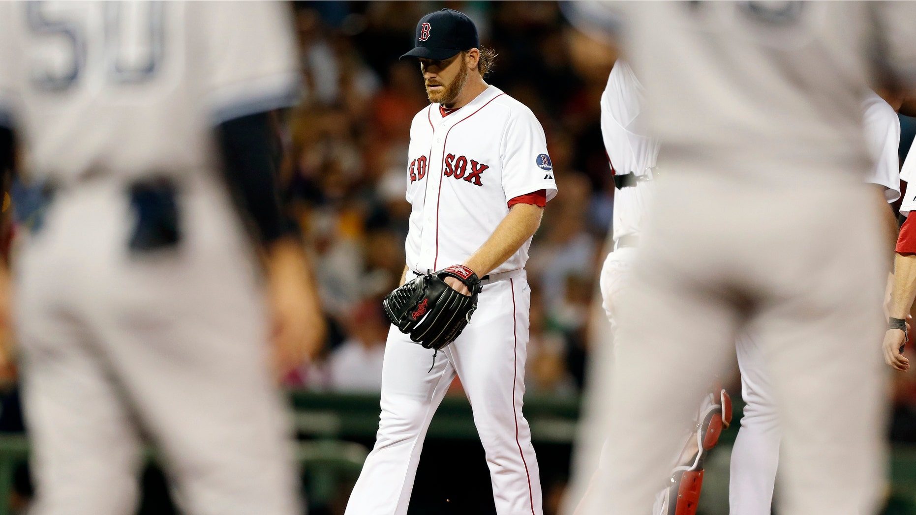 Boston Red Sox's Ryan Dempster leaves the baseball game in the sixth inning against the New York Yankees, Sunday, Aug. 18, 2013, in Boston. (AP Photo/Michael Dwyer)