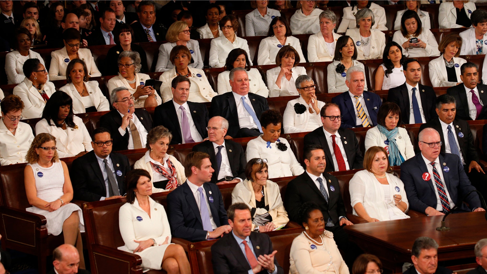U.S. President Donald Trump addresses Joint Session of Congress - Washington, U.S. - 28/02/17 - Democratic women in white listen as U.S. President Donald Trump addresses the U.S. Congress. REUTERS/Kevin Lamarque - RTS10VK9