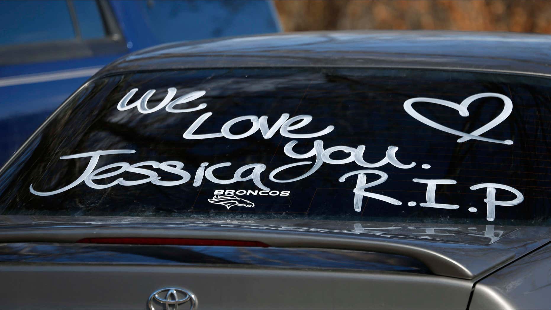 Feb. 7, 2015: Message covers the back window of a car parked by a mourner of Jessica Hernandez.