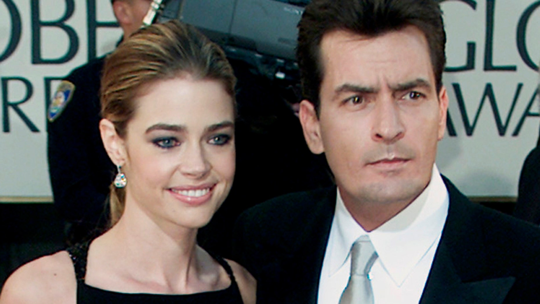 January 20, 2002. Charlie Sheen and fiance Denise Richards pose during arrivals at the 59th annual Golden Globe Awards in Beverly Hills.
